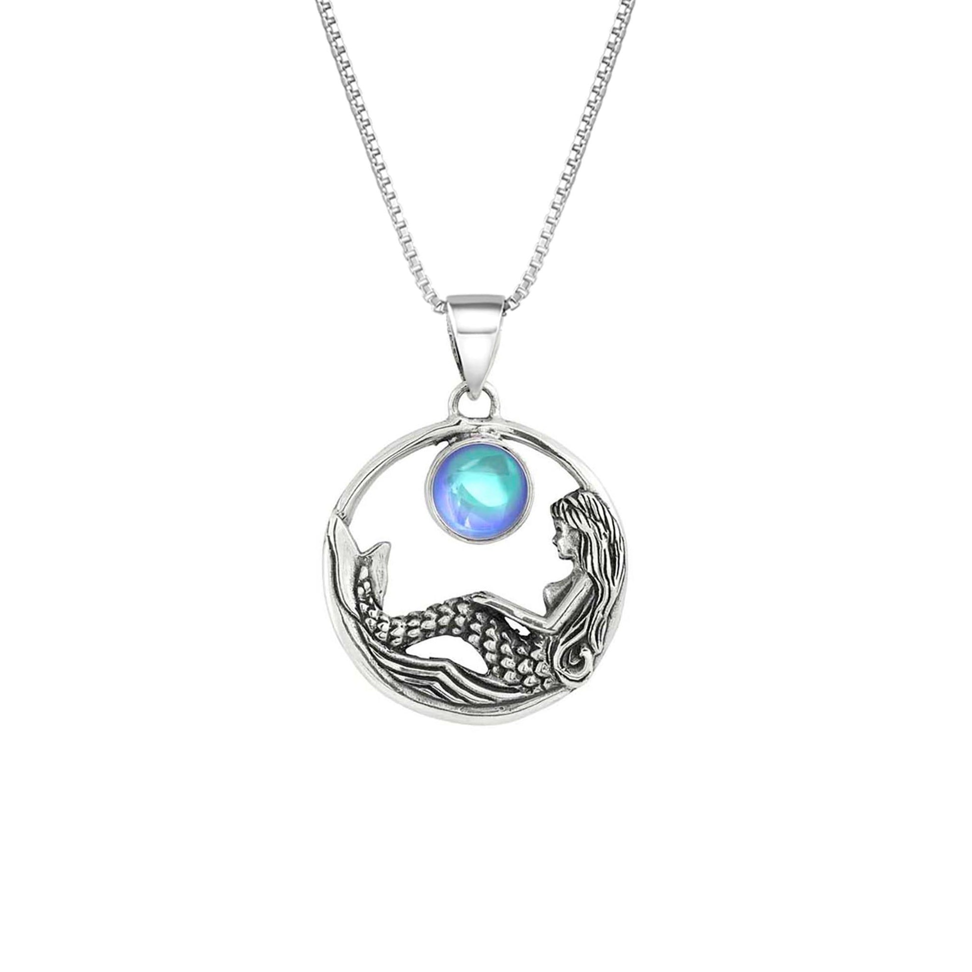 Mermaid Pendant features a beautiful mermaid sitting gracefully beneath a stunning 9mm glowing, polished aqua crystal. The pendant comes with an 18" sterling silver .7mm box chain included.