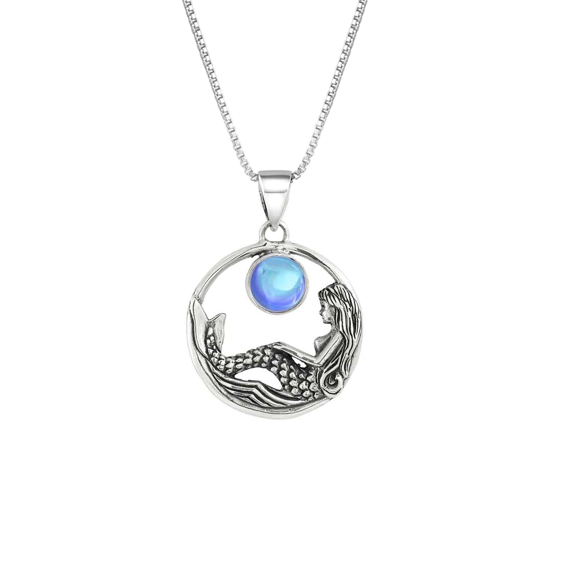 Mermaid Pendant features a beautiful mermaid sitting gracefully beneath a stunning 9mm glowing, polished blue crystal. The pendant comes with an 18" sterling silver .7mm box chain included.