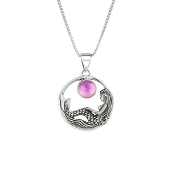 Mermaid Pendant features a beautiful mermaid sitting gracefully beneath a stunning 9mm glowing, polished pink crystal. The pendant comes with an 18" sterling silver .7mm box chain included.