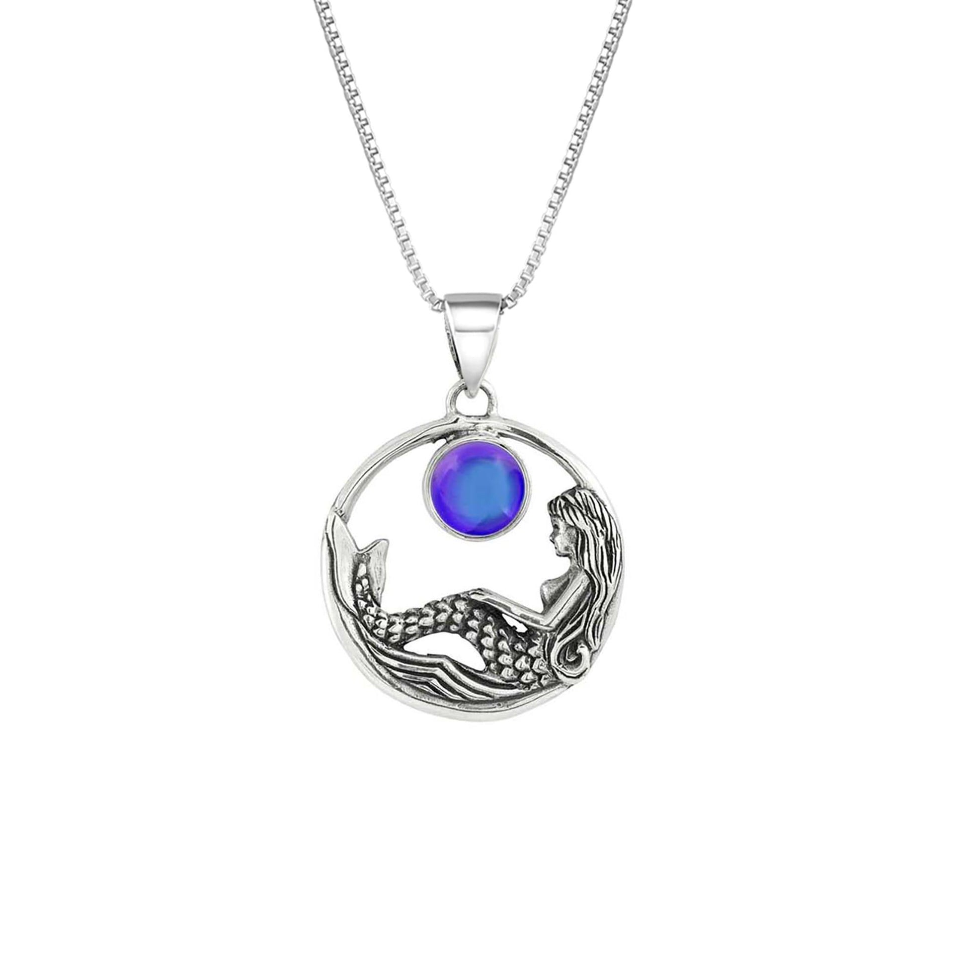 Mermaid Pendant features a beautiful mermaid sitting gracefully beneath a stunning 9mm glowing, polished violet crystal. The pendant comes with an 18" sterling silver .7mm box chain included.