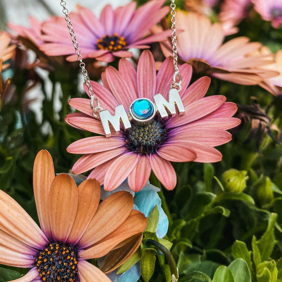 MOM Pendant crafted with utmost precision and attention to detail. Made with high-quality materials. The polished aqua pendant comes with an 18" sterling silver .7mm box chain included.