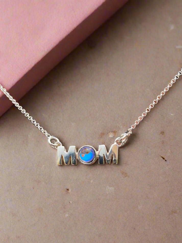 MOM Pendant crafted with utmost precision and attention to detail. Made with high-quality materials. The frosted blue pendant comes with an 18" sterling silver .7mm box chain included.