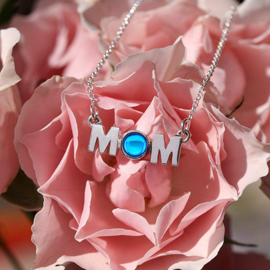 MOM Pendant crafted with utmost precision and attention to detail. Made with high-quality materials. The polished blue pendant comes with an 18" sterling silver .7mm box chain included.