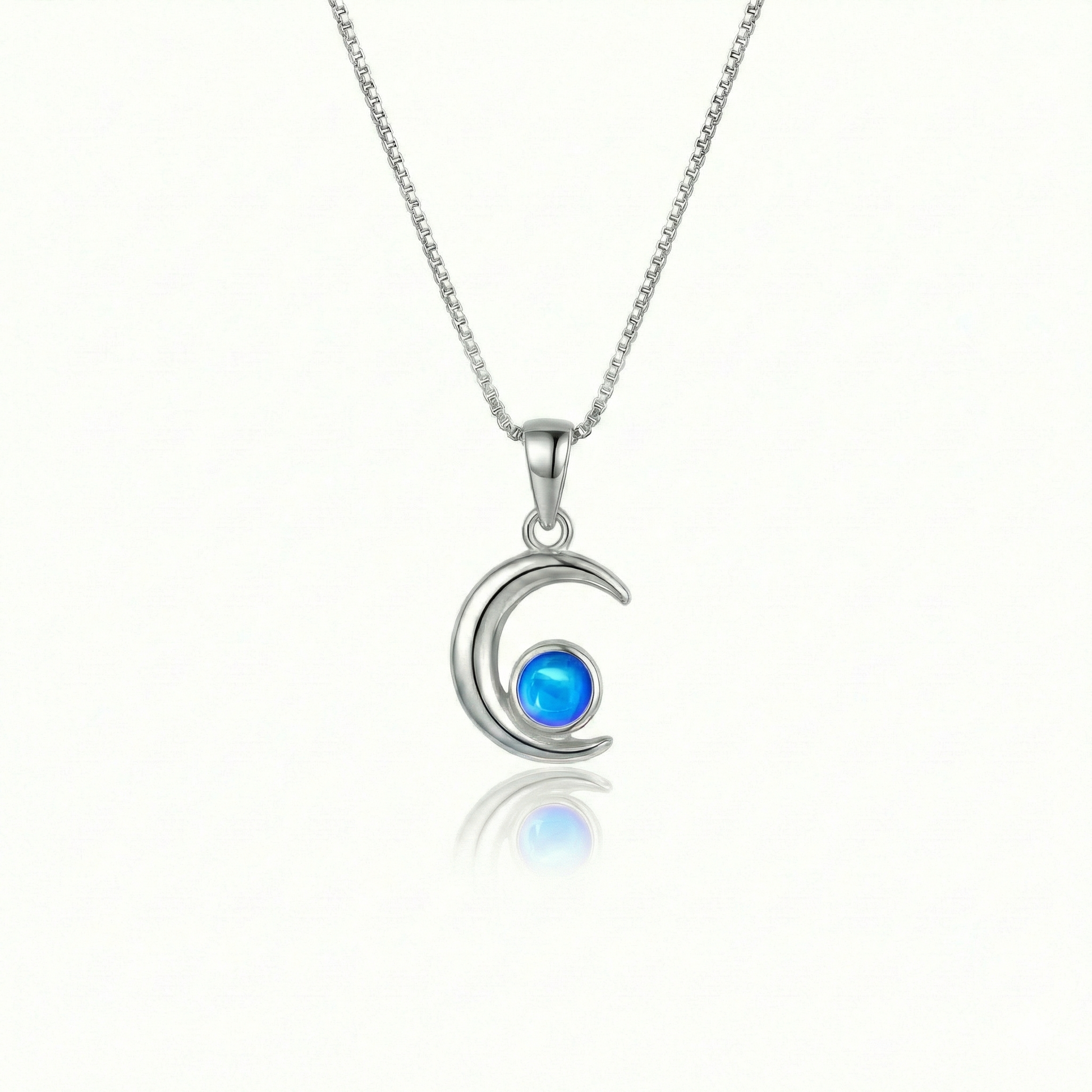 Moon Pendant crafted from high-quality materials, comes with an 18" sterling silver  chain and 5mm polished blue stone.
