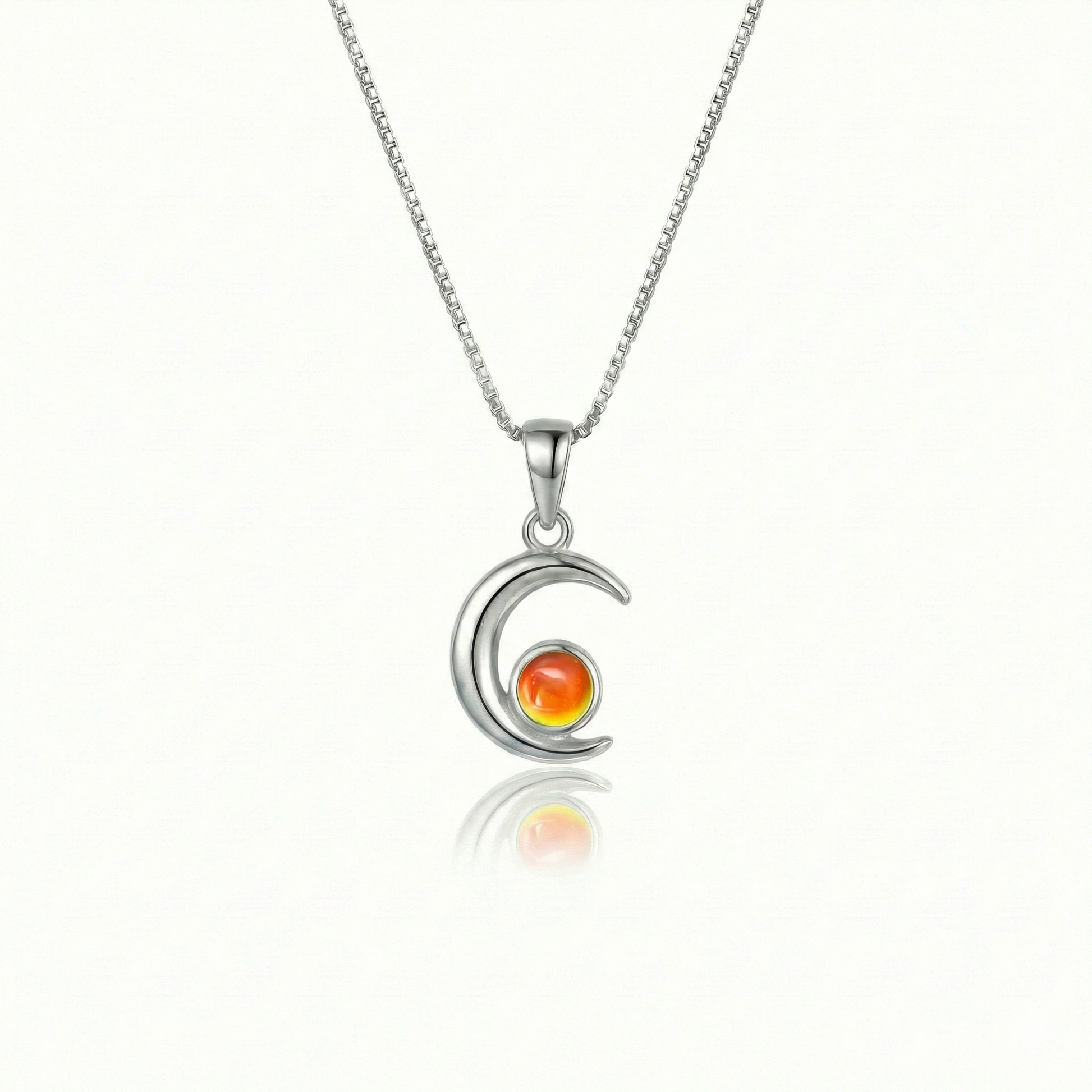 Moon Pendant crafted from high-quality materials, comes with an 18" sterling silver  chain and 5mm polished fire stone.