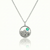 Silver necklace with a moose, mountain, and green gem pendant.