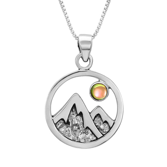 Mountain Pendant featuring a beautiful depiction of mountains under the moon or sun, this pendant captures the serene beauty of nature. The polished fire pendant includes an 18" sterling silver .7mm box chain.