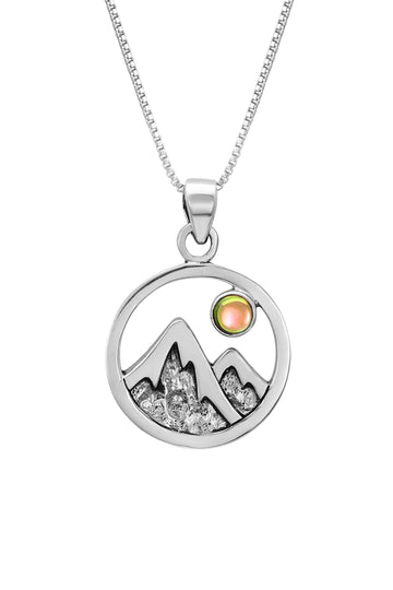 Mountain Pendant featuring a beautiful depiction of mountains under the moon or sun, this pendant captures the serene beauty of nature. The polished fire pendant includes an 18" sterling silver .7mm box chain.