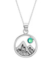 Mountain Pendant featuring a beautiful depiction of mountains under the moon or sun, this pendant captures the serene beauty of nature. The polished green pendant includes an 18" sterling silver .7mm box chain.