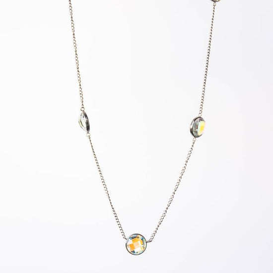 This versatile necklace features 9mm multi-colored stones set in a reversible design, allowing you to showcase different aesthetics with a single piece. The adjustable 16"-18" length adapts to various necklines and layering preferences, making it an essential addition to any jewelry collection. 