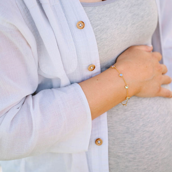 This versatile bracelet features six reversible 5mm stones set in 18k gold PVD-coated stainless steel, offering sophisticated styling flexibility with every wear. 