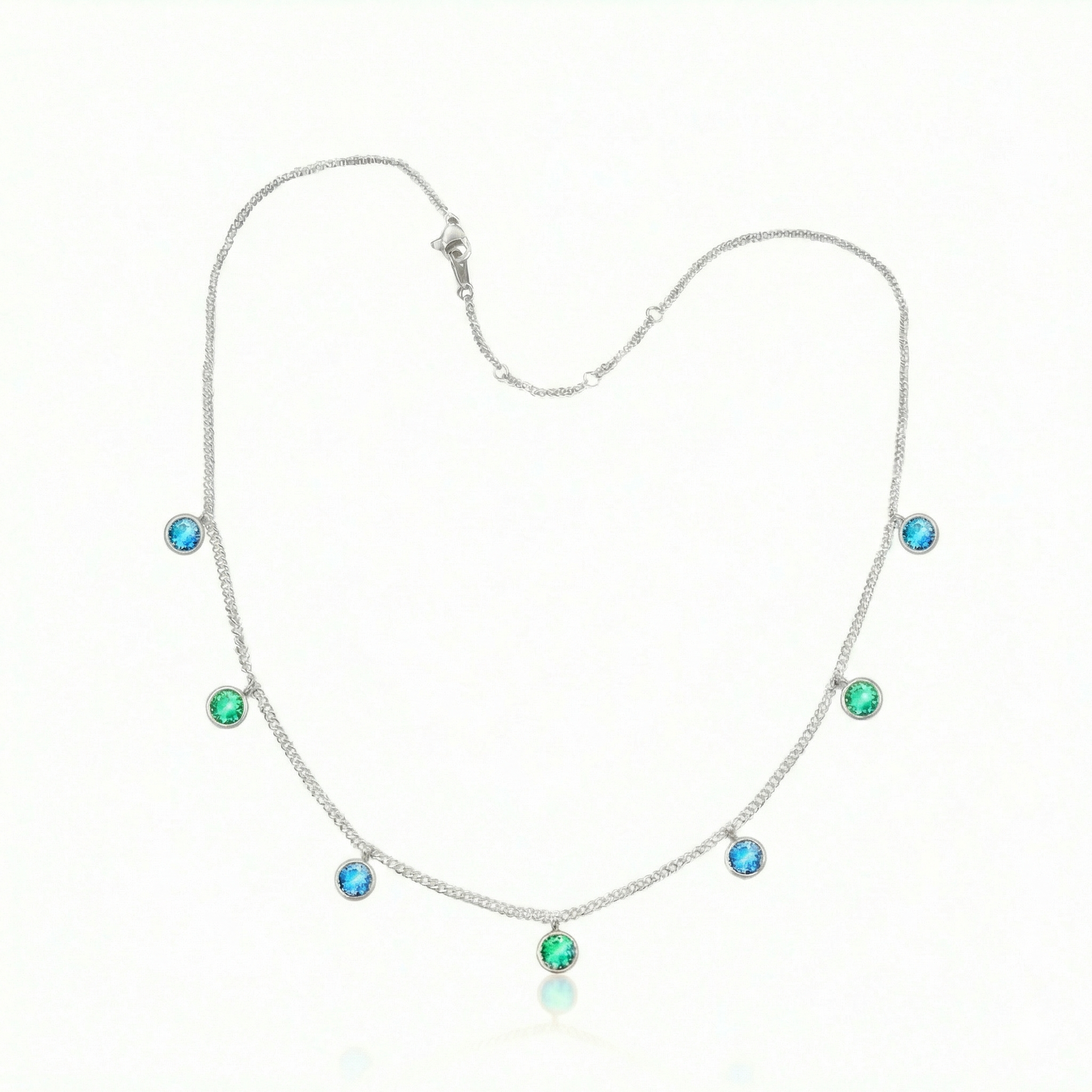 Multi Stone Necklace featuring radiant 5mm blue/green stones arranged in a harmonious multi-stone composition. The adjustable 16-18" stainless silver chain provides flexibility to suit your preferred drape and neckline. Crafted for those who appreciate quality materials and thoughtful design. 