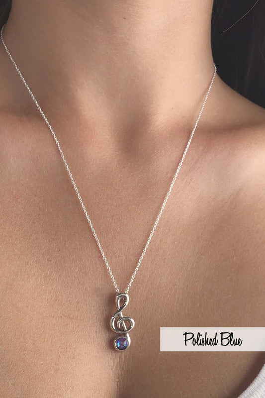 Musical Note Pendant is perfect for musicians and music enthusiasts alike.  The stunning polished blue crystal at the bottom of the pendant adds a captivating accent to the elegant scroll design. The pendant comes with an 18" sterling silver 1mm cable chain included.