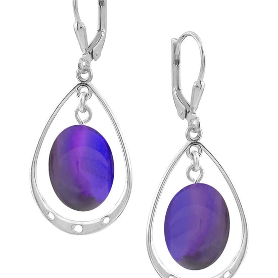 Oval with Loop Earrings featuring oval polished violet crystals elegantly accented with sterling silver loops. The earrings come equipped with secure lever backs for a comfortable fit.