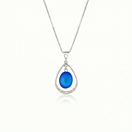 Oval with Loop Pendant handmade pendant pairs beautifully with any outfit, and you’ll love how the frosted blue crystal oval shines with an iridescent glow of color from within. The pendant comes with an 18" sterling silver .7mm box chain included.