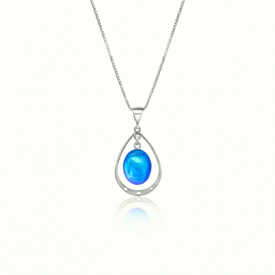 Oval with Loop Pendant handmade pendant pairs beautifully with any outfit, and you’ll love how the polished blue crystal oval shines with an iridescent glow of color from within. The pendant comes with an 18" sterling silver .7mm box chain included.
