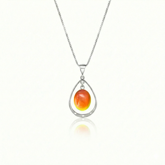 Oval with Loop Pendant handmade pendant pairs beautifully with any outfit, and you’ll love how the polished fire crystal oval shines with an iridescent glow of color from within. The pendant comes with an 18" sterling silver .7mm box chain included.