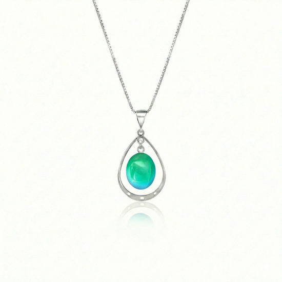 Oval with Loop Pendant handmade pendant pairs beautifully with any outfit, and you’ll love how the polished green crystal oval shines with an iridescent glow of color from within. The pendant comes with an 18" sterling silver .7mm box chain included.