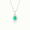 Oval with Loop Pendant handmade pendant pairs beautifully with any outfit, and you’ll love how the polished green crystal oval shines with an iridescent glow of color from within. The pendant comes with an 18" sterling silver .7mm box chain included.