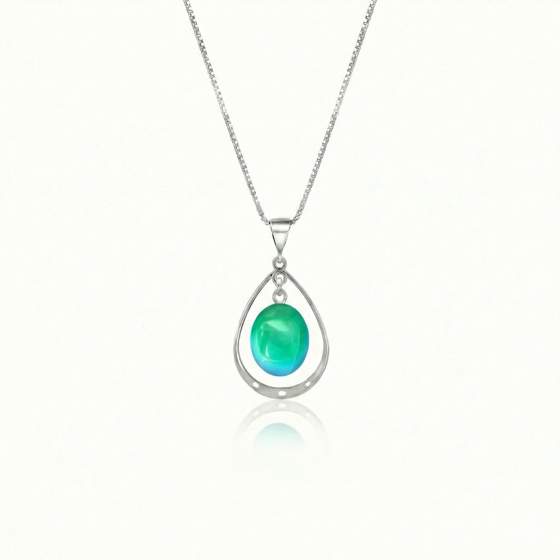 Oval with Loop Pendant handmade pendant pairs beautifully with any outfit, and you’ll love how the polished green crystal oval shines with an iridescent glow of color from within. The pendant comes with an 18" sterling silver .7mm box chain included.