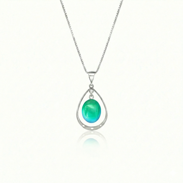 Oval with Loop Pendant handmade pendant pairs beautifully with any outfit, and you’ll love how the polished green crystal oval shines with an iridescent glow of color from within. The pendant comes with an 18" sterling silver .7mm box chain included.