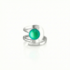 Raima Ring features a design that is not symmetrical, yet beautifully balanced. Its airy and light aesthetic brilliantly showcases the sparkling, frosted green crystal at its center. Crafted from sturdy sterling silver, this ring is adjustable, allowing you to customize the fit starting at size 7.5.