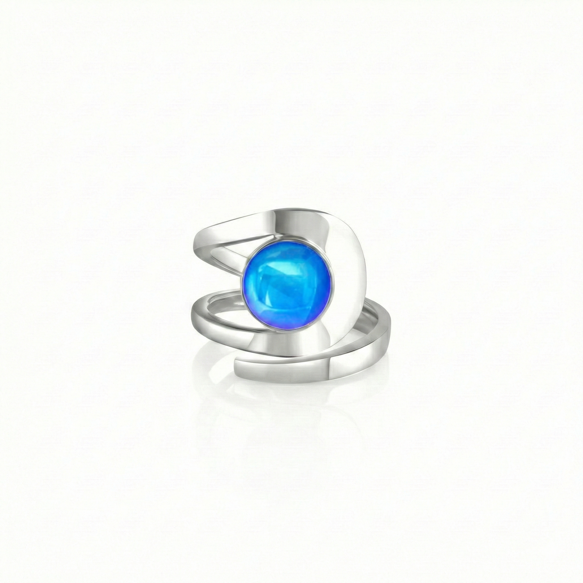 Raima Ring features a design that is not symmetrical, yet beautifully balanced. Its airy and light aesthetic brilliantly showcases the sparkling, polished blue crystal at its center. Crafted from sturdy sterling silver, this ring is adjustable, allowing you to customize the fit starting at size 7.5.