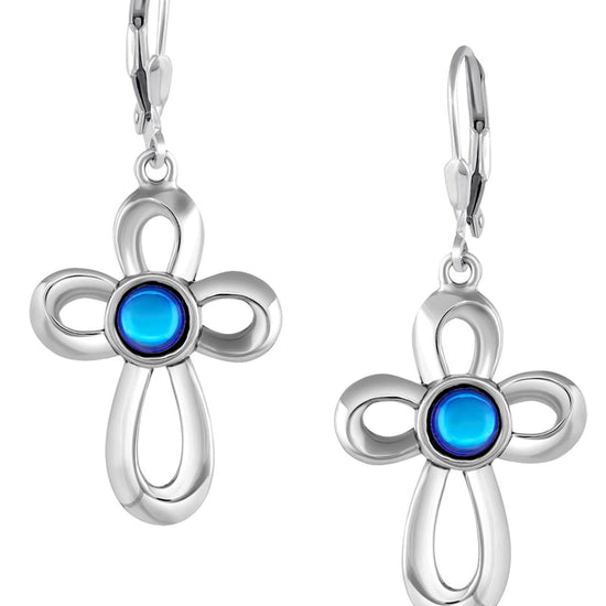 Ribbon Cross Earrings feature lever-back components that add a touch of elegance to the traditional cross design.  At the center, our signature color-changing polished blue crystal beautifully enhances this classic religious symbol. These earrings are crafted from high-quality sterling silver, ensuring durability and shine. 