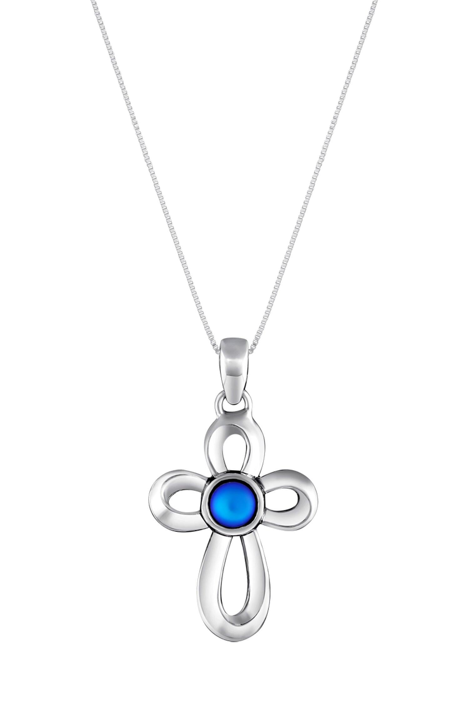 Ribbon Cross Pendant features a beautifully crafted design that adds a touch of elegance to the traditional cross, creating an eye-catching look.  At the center, our signature color-changing frosted blue crystal beautifully enhances this classic religious symbol. These earrings are crafted from high-quality sterling silver, ensuring durability and shine. 