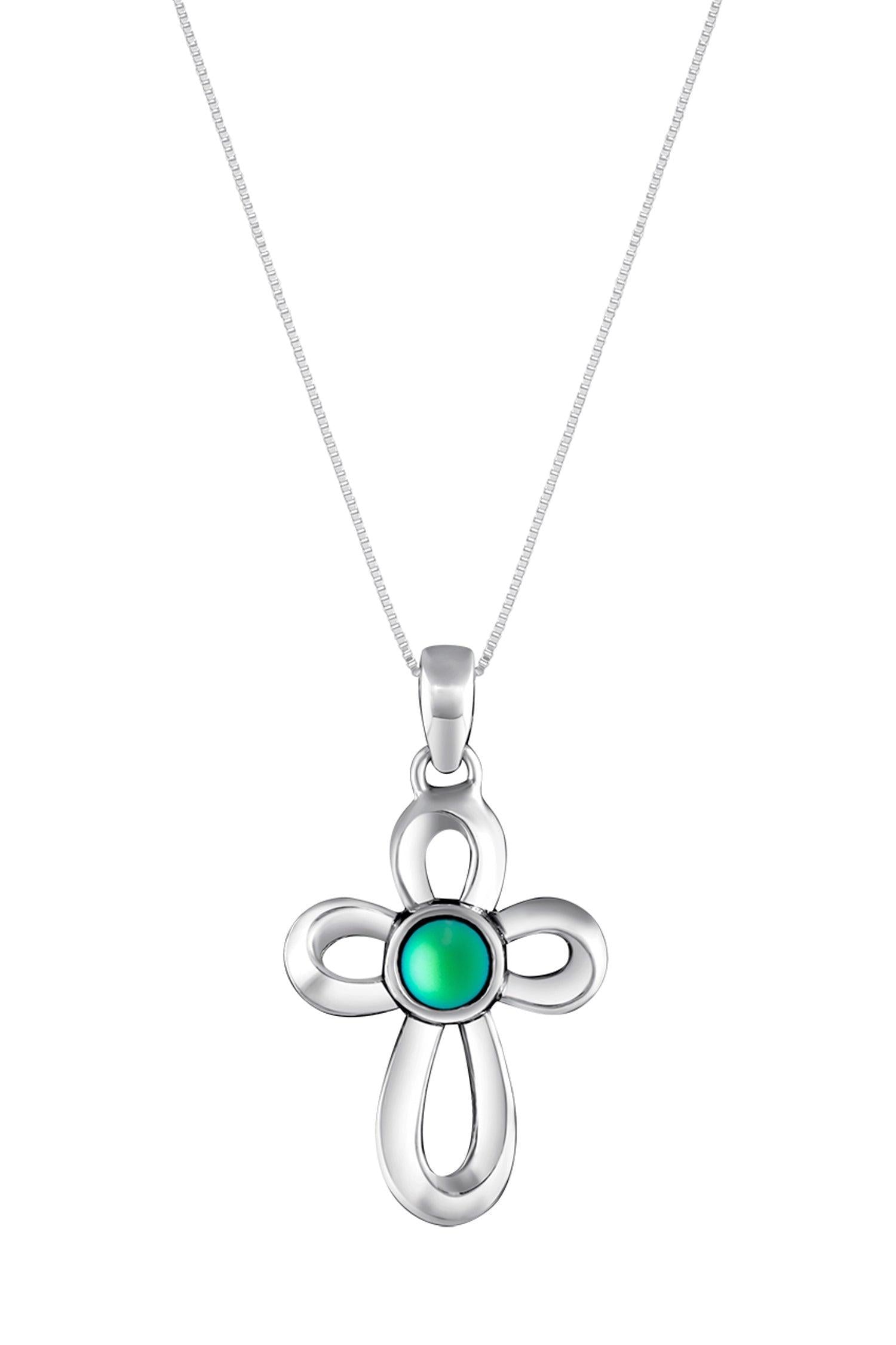 Ribbon Cross Pendant features a beautifully crafted design that adds a touch of elegance to the traditional cross, creating an eye-catching look.  At the center, our signature color-changing frosted green crystal beautifully enhances this classic religious symbol. These earrings are crafted from high-quality sterling silver, ensuring durability and shine. 