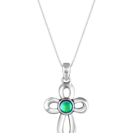 Ribbon Cross Pendant features a beautifully crafted design that adds a touch of elegance to the traditional cross, creating an eye-catching look.  At the center, our signature color-changing polished green crystal beautifully enhances this classic religious symbol. These earrings are crafted from high-quality sterling silver, ensuring durability and shine. 