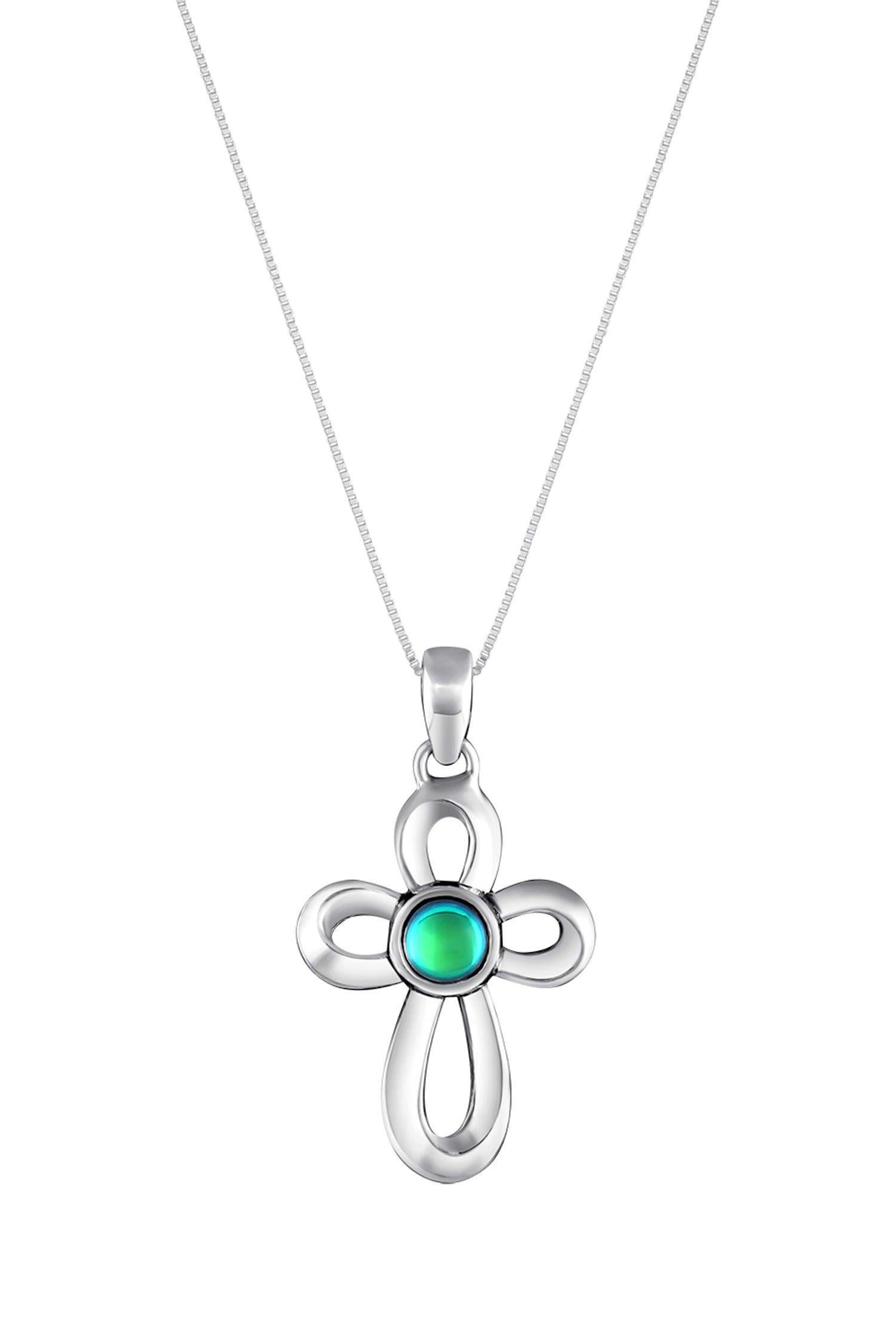 Ribbon Cross Pendant features a beautifully crafted design that adds a touch of elegance to the traditional cross, creating an eye-catching look.  At the center, our signature color-changing polished green crystal beautifully enhances this classic religious symbol. These earrings are crafted from high-quality sterling silver, ensuring durability and shine. 