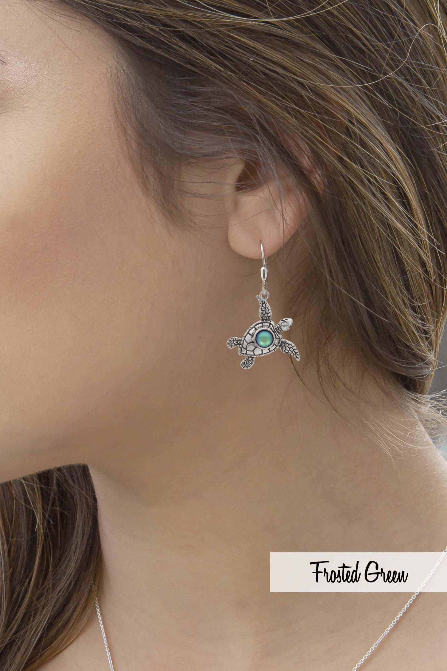 Sea Turtle Earrings, inspired by the Hawaiian Turtle, known as Honu. Crafted from sterling silver, these earrings with frosted green stone beautifully showcase your love for the ocean.
