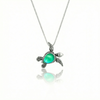 Sideways Sea Turtle Pendant brings wisdom and good luck that comes with an 18" sterling silver and a polished green stone.