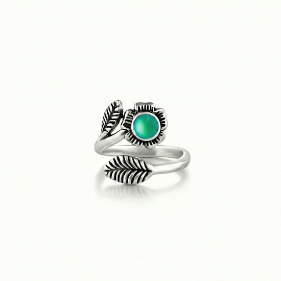 Silver Flower Adjustable Ring is a stunning piece that beautifully showcases a 5mm frosted green stone at its center. 