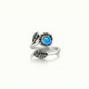 Silver Flower Adjustable Ring is a stunning piece that beautifully showcases a 5mm polished blue stone at its center. 