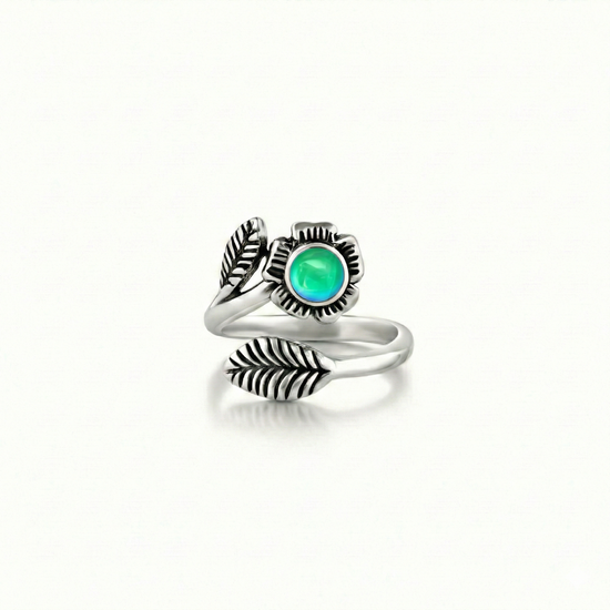 Silver Flower Adjustable Ring is a stunning piece that beautifully showcases a 5mm polished green stone at its center. 