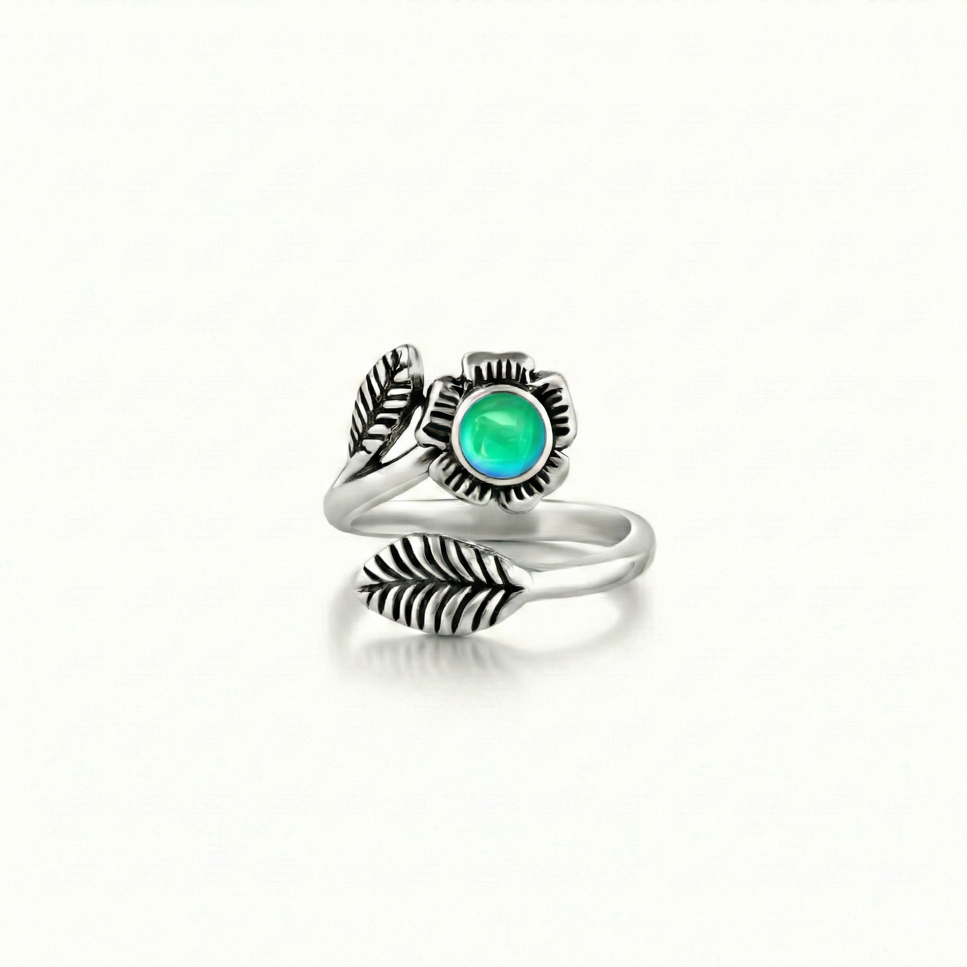 Silver Flower Adjustable Ring is a stunning piece that beautifully showcases a 5mm polished green stone at its center. 