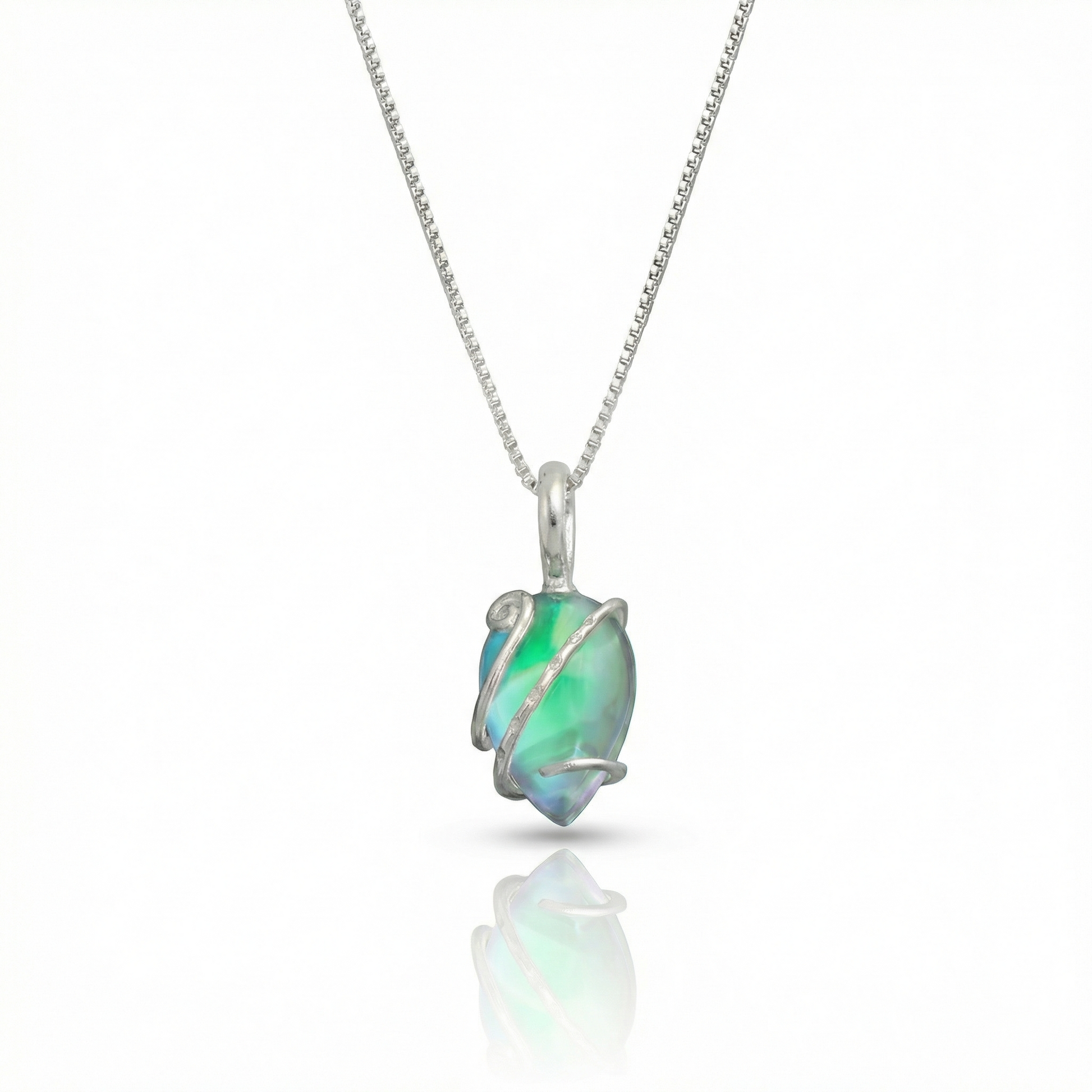 Single Wrap Pendant features a delicate sterling silver strand that beautifully wraps around a brilliant polished green crystal. The pendant includes an 18" sterling silver .7mm box chain.