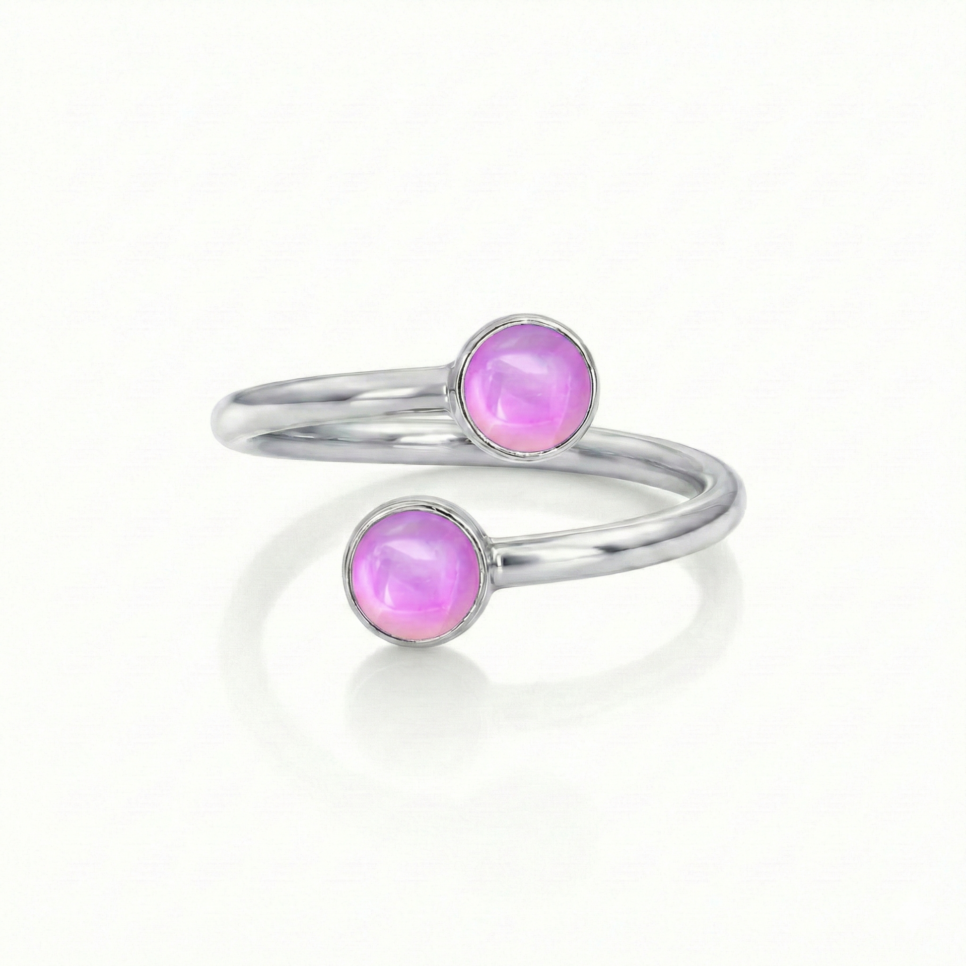 Small Double Ring features two exquisite 5mm polished pink circle crystals that add a touch of sparkle and elegance.