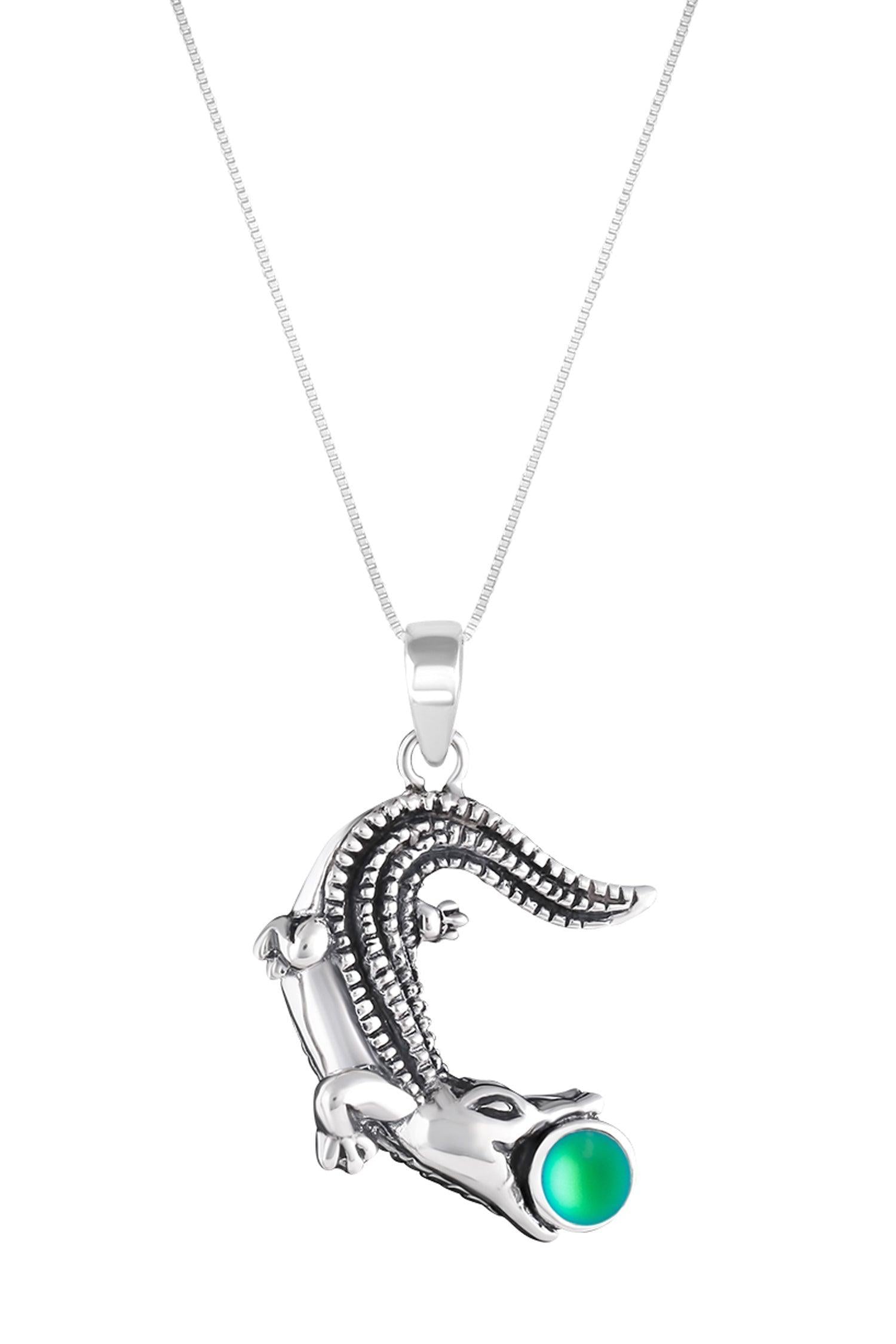 Small Gator Pendant, custom-made for Gatorland in Florida, this pendant showcases a unique design that captures the spirit of the iconic alligator. Featuring a stunning 5mm frosted green stone set in solid .925 sterling silver.