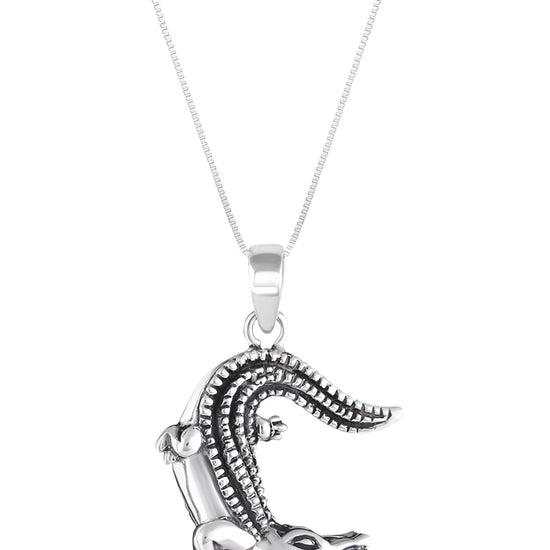 Small Gator Pendant, custom-made for Gatorland in Florida, this pendant showcases a unique design that captures the spirit of the iconic alligator. Featuring a stunning 5mm polished blue stone set in solid .925 sterling silver.