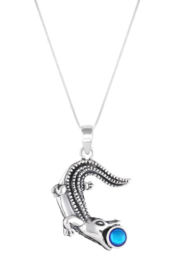 Small Gator Pendant, custom-made for Gatorland in Florida, this pendant showcases a unique design that captures the spirit of the iconic alligator. Featuring a stunning 5mm polished blue stone set in solid .925 sterling silver.