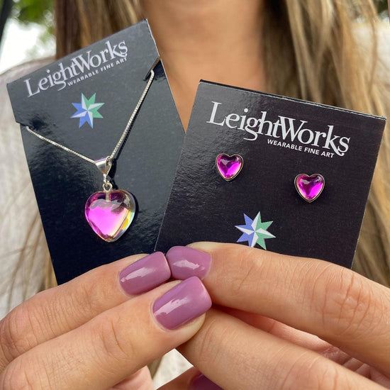 Small Heart Pendant featuring a sterling silver chain and matching Heart Stud Earrings. Made from durable sterling silver, the polished pink stone pendant with a 16" sterling silver box chain.