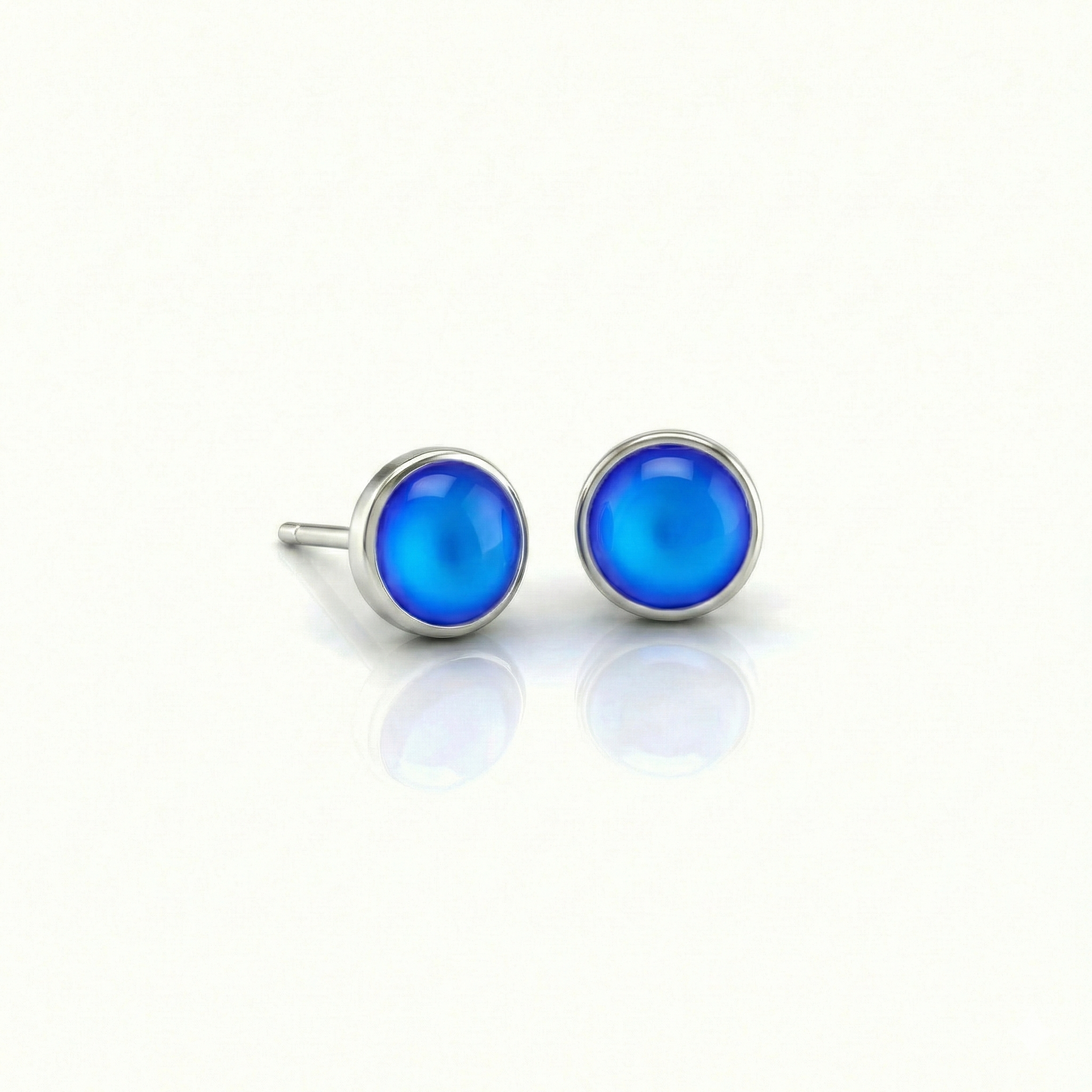 Small Stud Earrings with 5 mm frosted blue crystal. Designed with comfortable backs, these earrings ensure a secure fit.