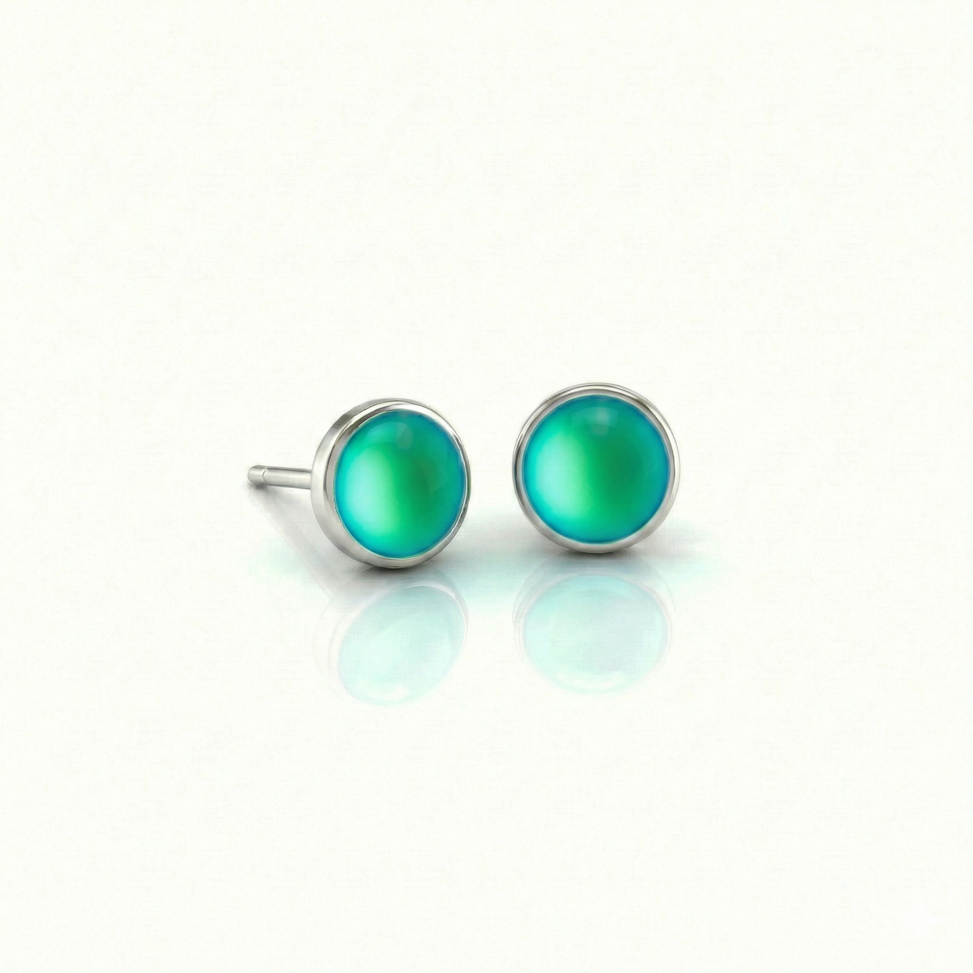 Small Stud Earrings with 5 mm frosted green crystal. Designed with comfortable backs, these earrings ensure a secure fit.