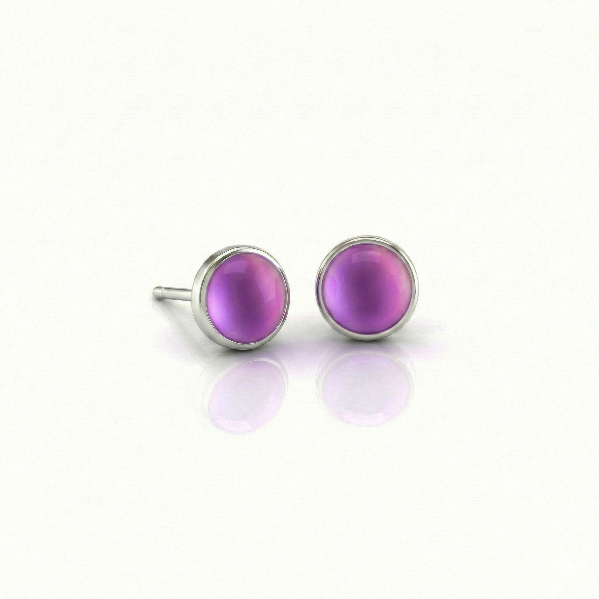 Small Stud Earrings with 5 mm frosted pink crystal. Designed with comfortable backs, these earrings ensure a secure fit.