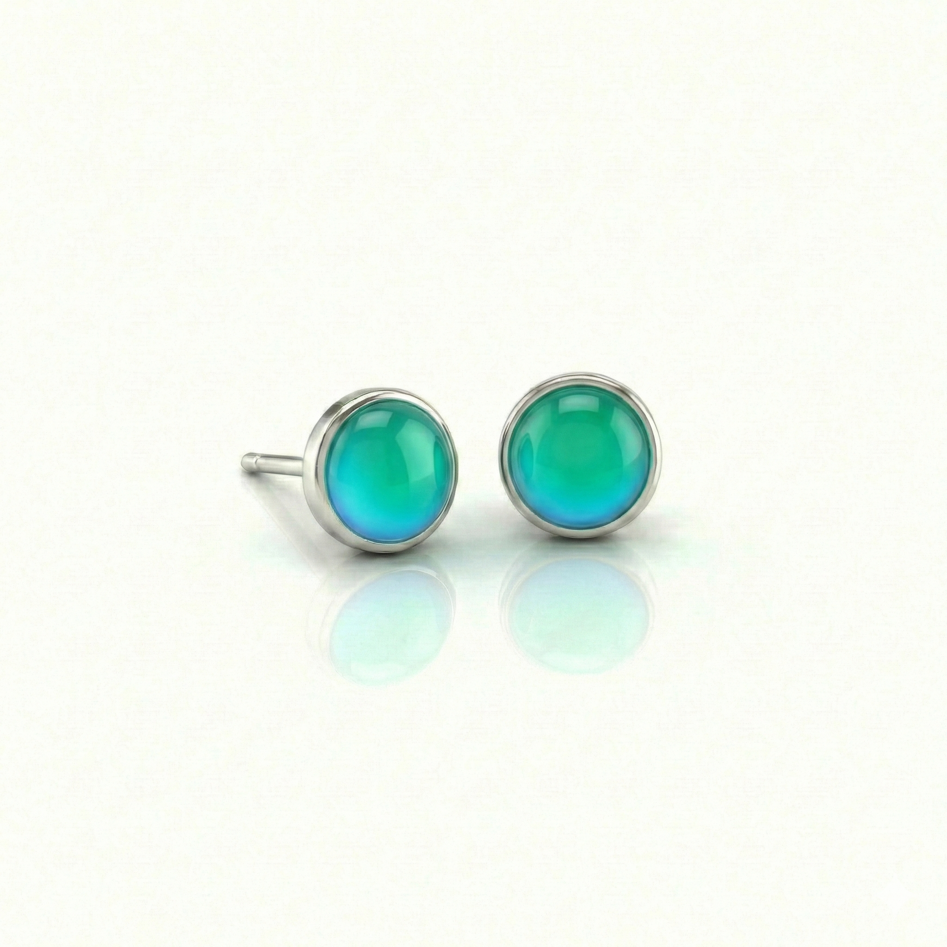Small Stud Earrings with 5 mm polished green crystal. Designed with comfortable backs, these earrings ensure a secure fit.