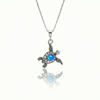 Small Turtle Pendant featuring a charming design, this pendant is adorned with a 5mm polished blue stone that adds a touch of sparkle. It comes with an 18" .7mm sterling silver box chain, ensuring it’s ready to wear right away.