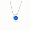 Small Wave Pendant, where it represents the "O" of Ocean Beach, while the surrounding silver symbolizes the "B." The pendant comes with a 1mm sterling silver snake chain, 18" long, with a frosted blue stone.